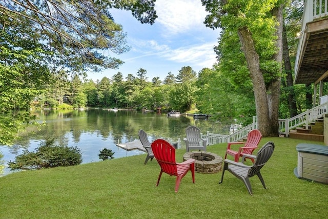72 S Shore Dr, Sturbridge, MA 01566 - view of green lawn with an outdoor fire pit, stairs, and a water view