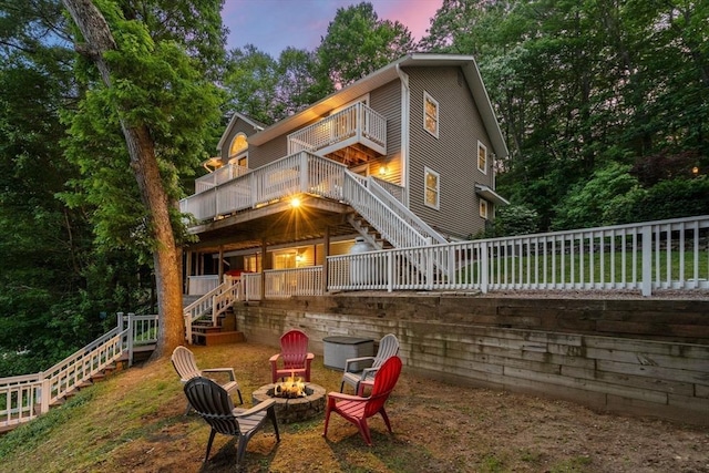 72 S Shore Dr, Sturbridge, MA 01566 - rear view of property with stairs, an outdoor fire pit, a balcony, and a wooden deck