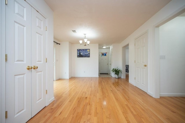 7 Willow Brook Ln, Blackstone, MA 01504 - unfurnished room with a chandelier, light wood finished floors, and baseboards