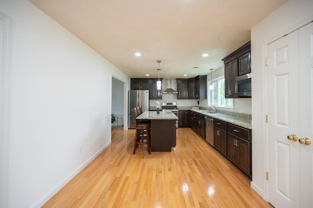7 Willow Brook Ln, Blackstone, MA 01504 - kitchen featuring wall chimney range hood, stainless steel appliances, a sink, a kitchen breakfast bar, and dark brown cabinets