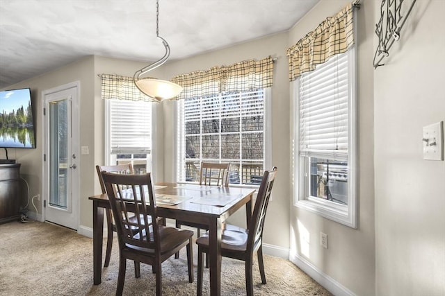 view of carpeted dining area