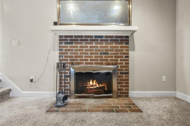 interior details featuring carpet floors and a brick fireplace