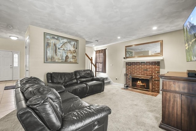 carpeted living room with a brick fireplace