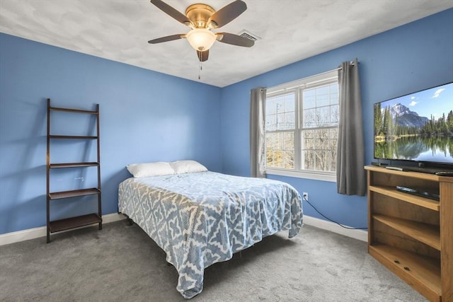 carpeted bedroom featuring ceiling fan