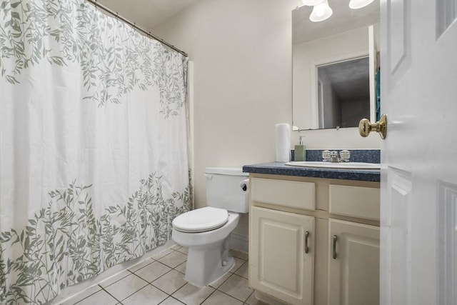 bathroom with vanity, tile patterned floors, and toilet