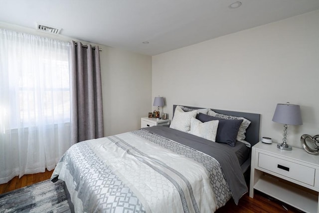 bedroom featuring dark wood-type flooring