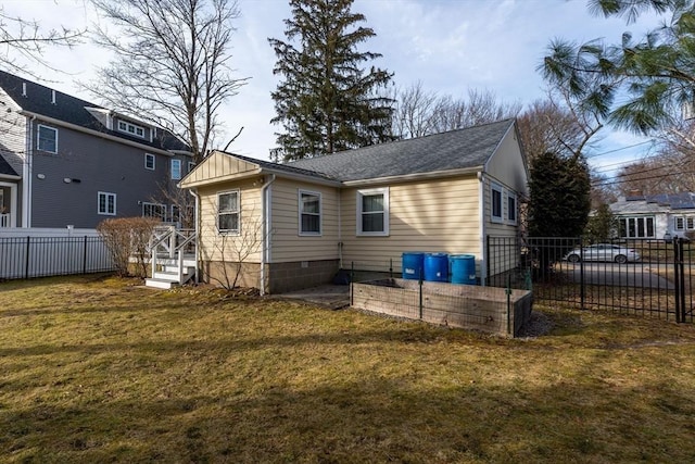 back of house with roof with shingles
