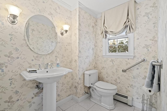 half bath featuring tile patterned flooring, toilet, a baseboard heating unit, baseboards, and wallpapered walls