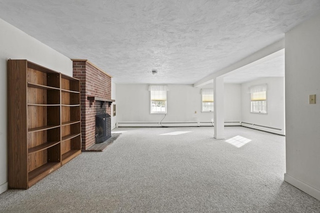 unfurnished living room featuring a brick fireplace, carpet flooring, a textured ceiling, and baseboards