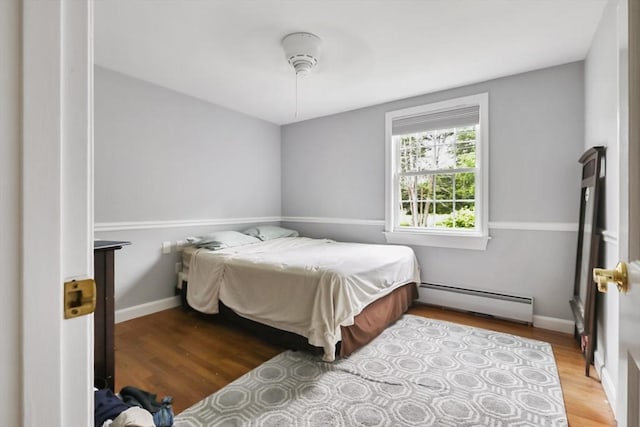 5 Fox Run Rd, Topsfield, MA 01983 - bedroom featuring a baseboard radiator, wood finished floors, and ceiling fan