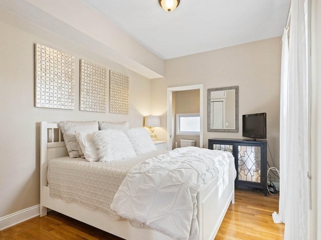 bedroom with wood-type flooring