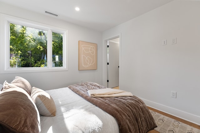 bedroom with hardwood / wood-style flooring