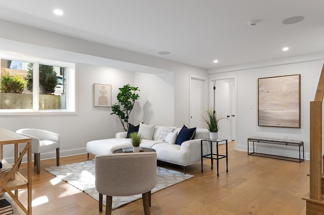 living room with light hardwood / wood-style flooring