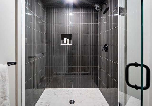 bathroom with a shower with shower door