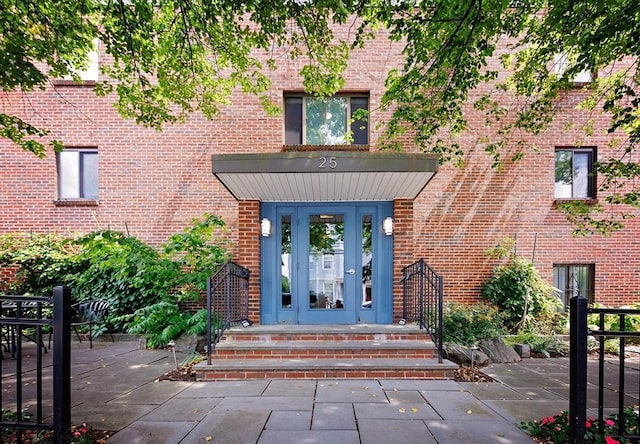 25 Linden Ave Unit 4, Somerville, MA 02143 - view of exterior entry featuring brick siding