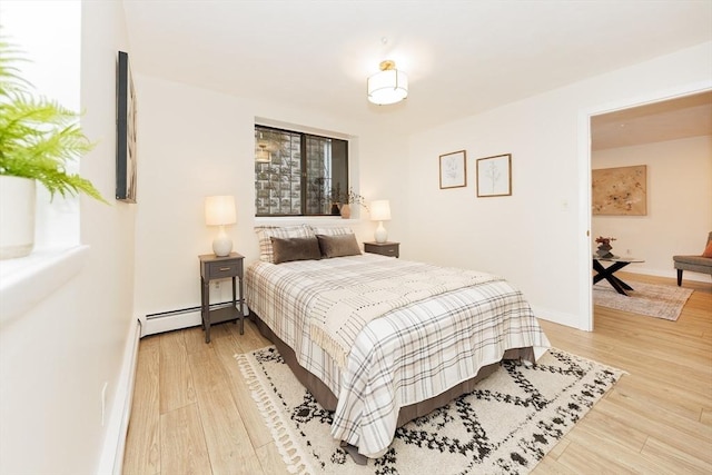 25 Linden Ave Unit 4, Somerville, MA 02143 - bedroom with a baseboard radiator and wood finished floors