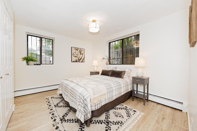 25 Linden Ave Unit 4, Somerville, MA 02143 - bedroom with baseboard heating and wood finished floors