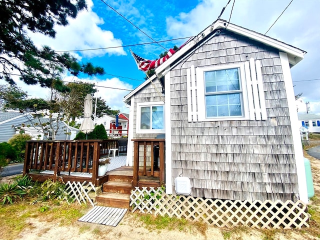 exterior space featuring a wooden deck