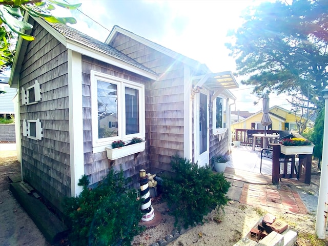 view of side of property featuring a patio area