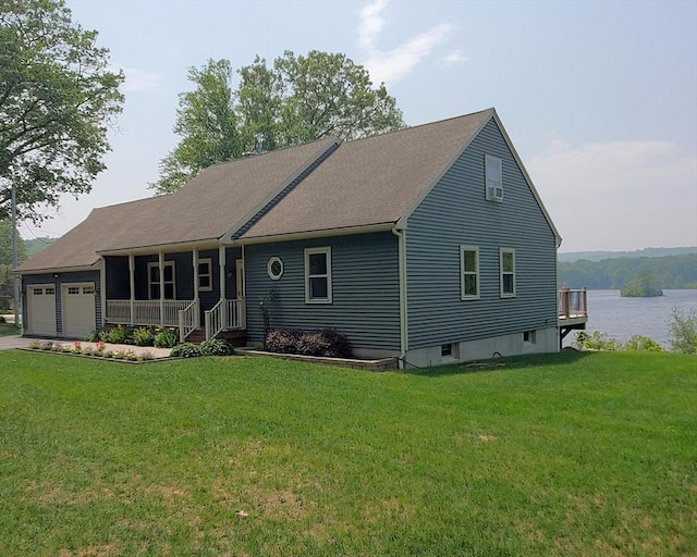 92 Wallace Ave, Auburn, MA 01501 - view of front of house with an attached garage, a front yard, driveway, covered porch, and a water view