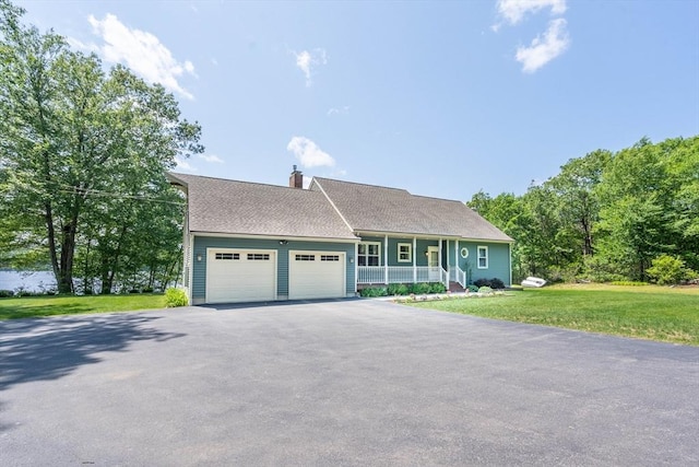 92 Wallace Ave, Auburn, MA 01501 - view of front of house featuring covered porch, a garage, asphalt driveway, a front yard, and a chimney