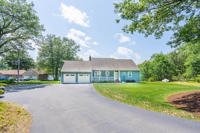 92 Wallace Ave, Auburn, MA 01501 - view of front facade with driveway, an attached garage, and a front lawn