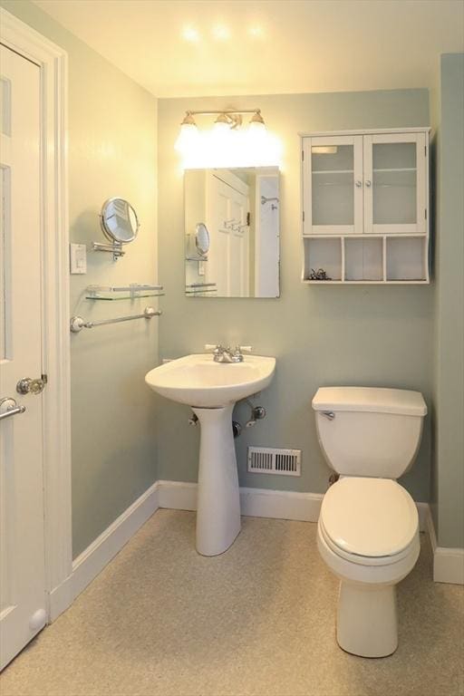 53 Perkins St, Stoneham, MA 02180 - half bath featuring baseboards and toilet