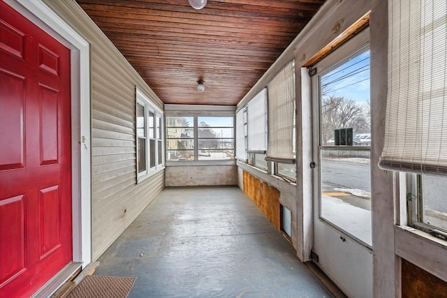 unfurnished sunroom with wooden ceiling