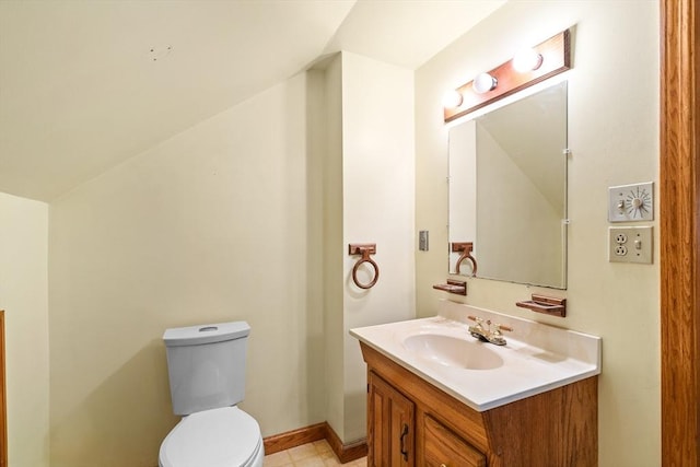 half bathroom with vanity and toilet