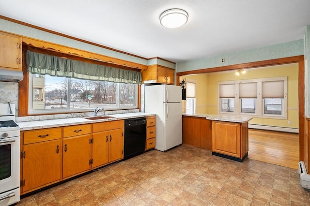 kitchen with under cabinet range hood, white appliances, a sink, light countertops, and baseboard heating