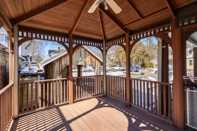 deck with a ceiling fan and a gazebo