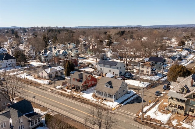 snowy aerial view with a residential view