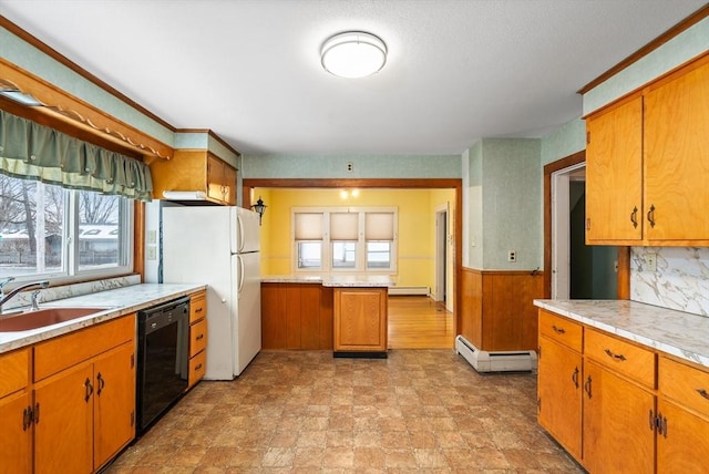 kitchen featuring a baseboard radiator, a sink, wainscoting, dishwasher, and plenty of natural light