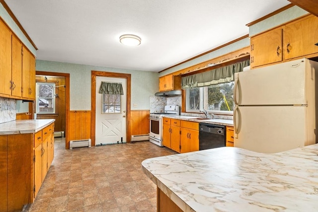 kitchen with a wainscoted wall, a baseboard radiator, light countertops, white appliances, and under cabinet range hood