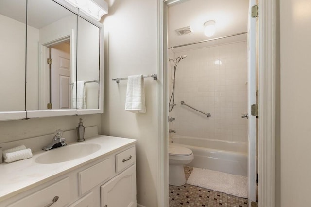 bathroom with visible vents, tile patterned flooring, vanity, toilet, and shower / tub combination