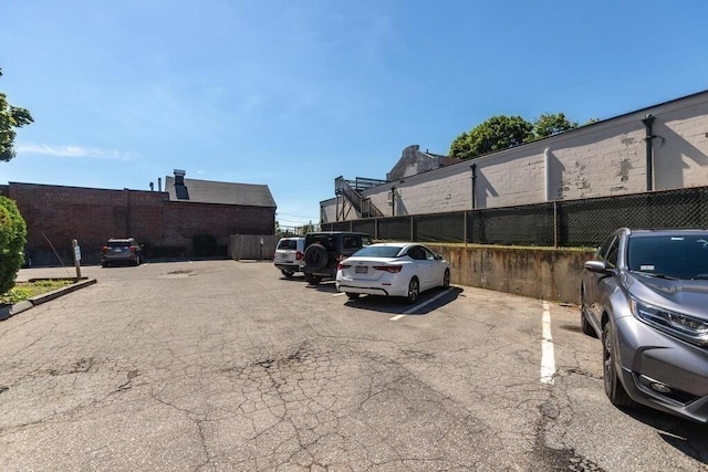 uncovered parking lot with fence