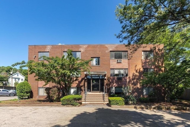 view of front of house featuring brick siding