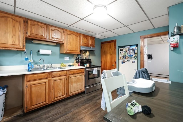 kitchen with dark wood-type flooring, sink, stainless steel range with electric cooktop, white refrigerator, and a baseboard radiator