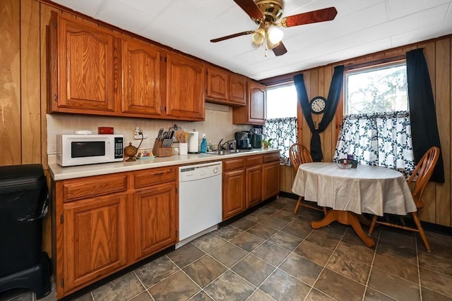 kitchen with ceiling fan, white appliances, and sink