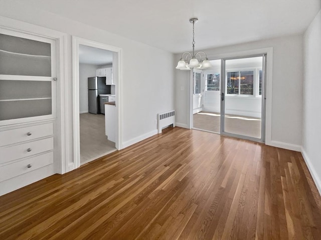 58 Morse Ave, Brockton, MA 02301 - unfurnished dining area with baseboards, a chandelier, wood finished floors, and radiator