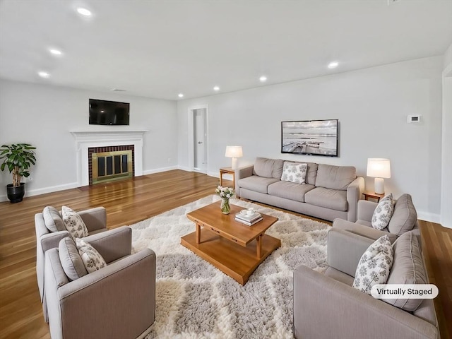 58 Morse Ave, Brockton, MA 02301 - living room with a brick fireplace, recessed lighting, baseboards, and wood finished floors