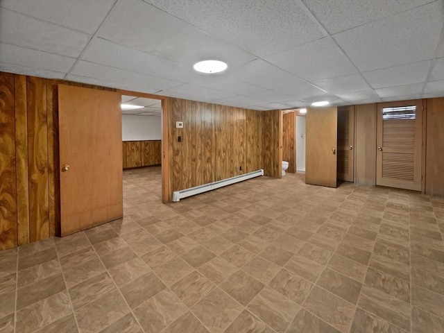 58 Morse Ave, Brockton, MA 02301 - finished basement with tile patterned floors, wood walls, a drop ceiling, and baseboard heating