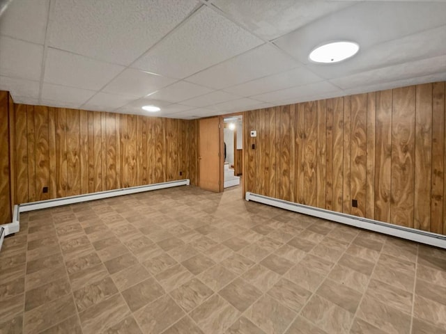 58 Morse Ave, Brockton, MA 02301 - finished below grade area with wood walls, a paneled ceiling, a baseboard radiator, and tile patterned floors
