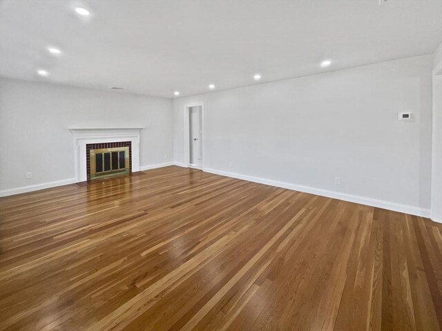 58 Morse Ave, Brockton, MA 02301 - unfurnished living room featuring baseboards, a fireplace, recessed lighting, and wood finished floors