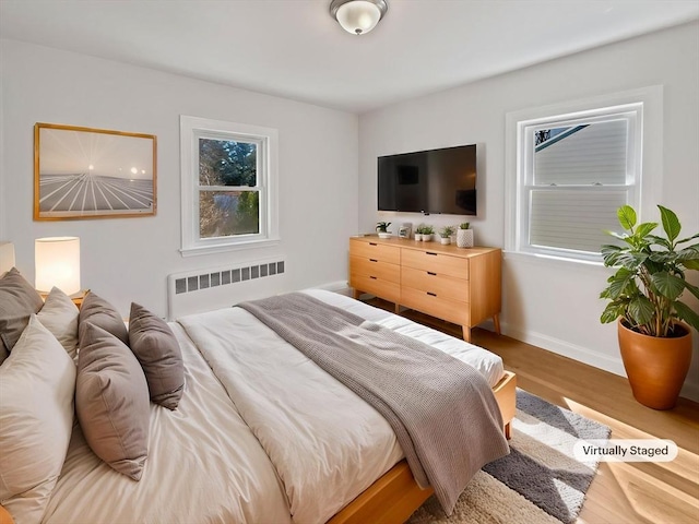 58 Morse Ave, Brockton, MA 02301 - bedroom featuring radiator heating unit, baseboards, and wood finished floors