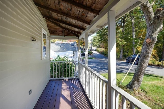 wooden terrace featuring covered porch