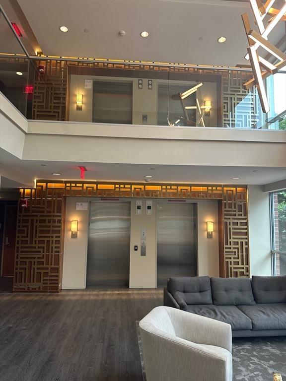 community lobby featuring a high ceiling and recessed lighting
