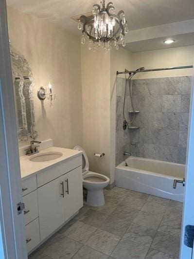full bath with vanity, toilet, a chandelier, and shower / tub combination