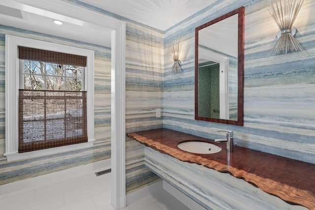 bathroom featuring wallpapered walls, visible vents, and vanity