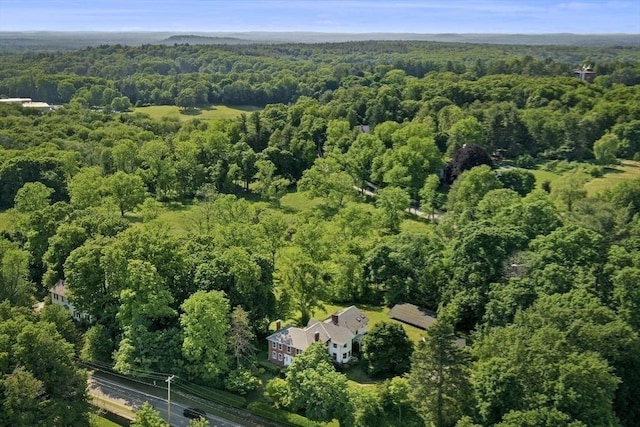 aerial view featuring a wooded view